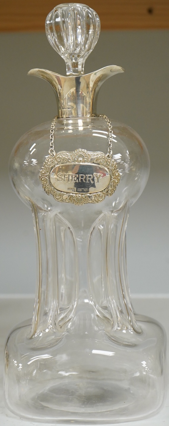 A silver collared glass decanter and ‘sherry’ label, 29cm